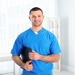 Male nurse holding a clipboard
